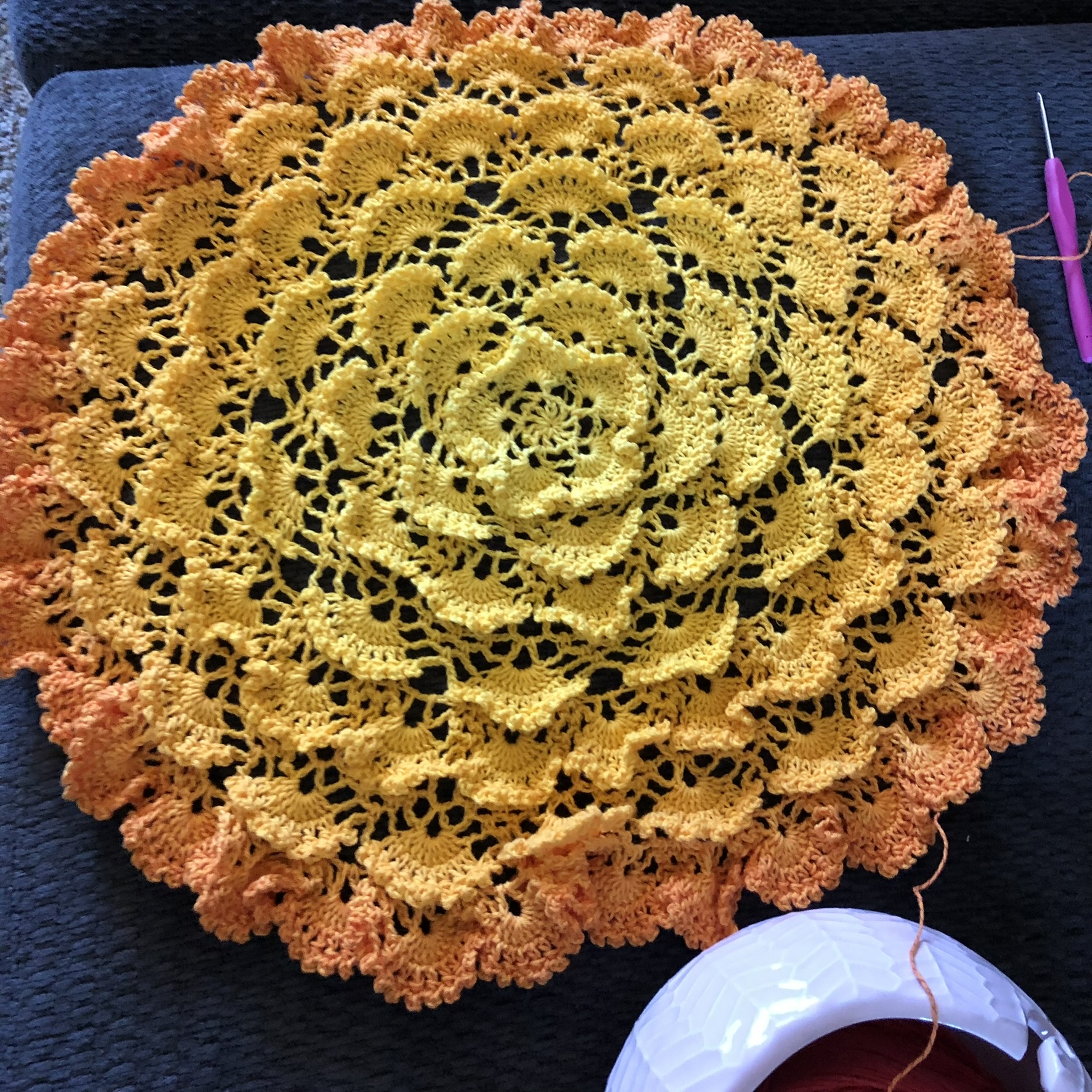 Crocheted doily with an intricate circular lace pattern